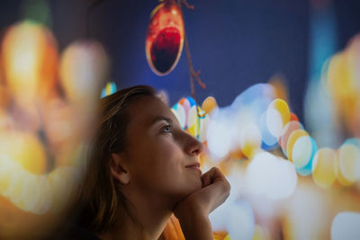 Portrait of young woman looking away