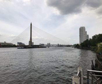 View of bridge over river in city