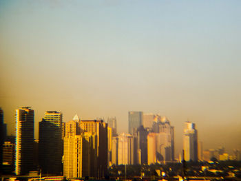 Modern cityscape against clear sky