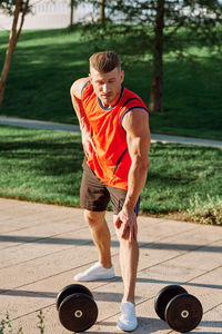 Side view of man exercising in gym