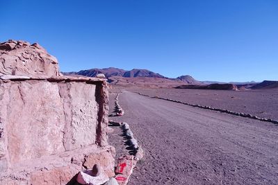 Scenic view of mountains against clear blue sky