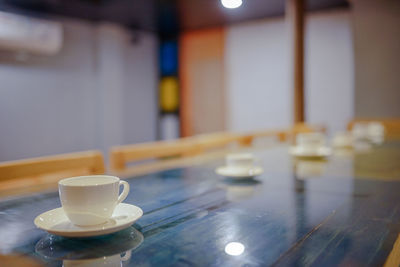 Close-up of coffee cup on table