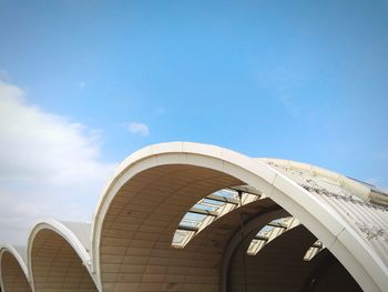 Low angle view of building against cloudy sky