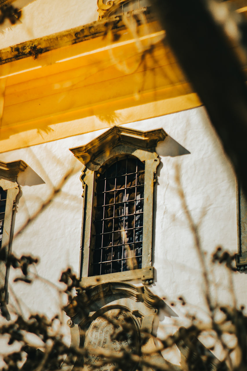 LOW ANGLE VIEW OF WINDOW ON BUILDING