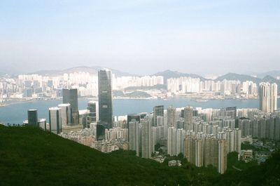 High angle view of city buildings against sky