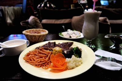 Close-up of served food on table