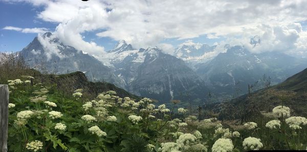 Scenic view of mountains against cloudy sky