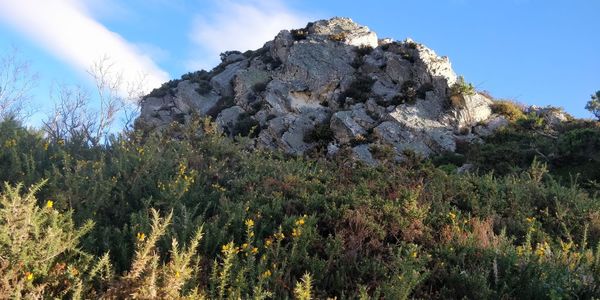 Low angle view of rocks against sky