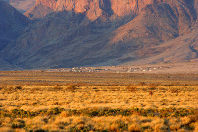 View of landscape with mountain range in the background