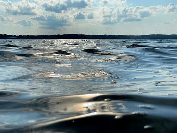 Surface level of sea against sky