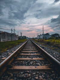 Surface level of railroad tracks against sky