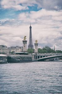 Bridge over river with buildings in background