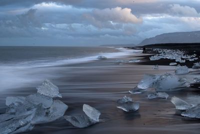 Scenic view of sea against sky during winter