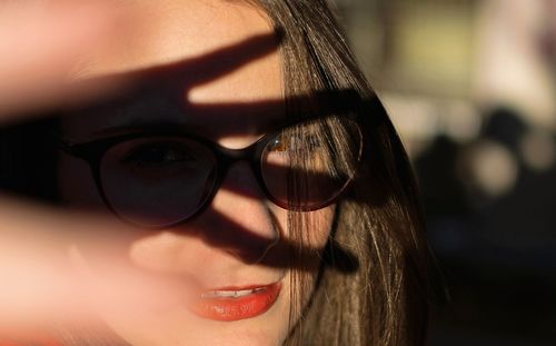 Close-up portrait of woman in eyeglasses