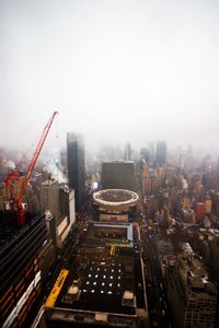 High angle view of buildings in city against sky