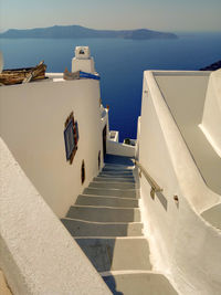 High angle view of staircase, buildings in front of sea