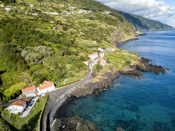 High angle view of road by sea against sky