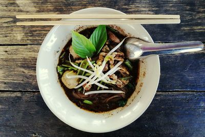 Directly above shot of soup in container on table