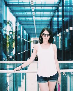 Young woman standing in modern building