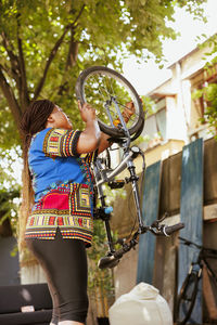 Low section of man riding bicycle