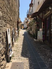 Narrow alley amidst buildings in city