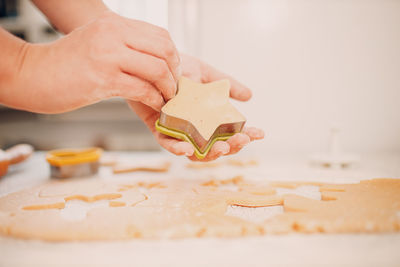 Midsection of person preparing food on table