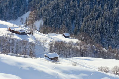 Snow covered landscape against mountain