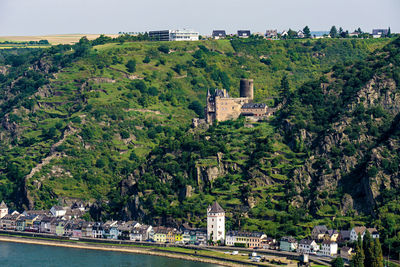 Houses in town against mountains