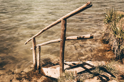 High angle view of wooden post in lake