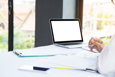 Man using laptop on table