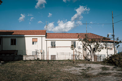 Exterior of old building against blue sky