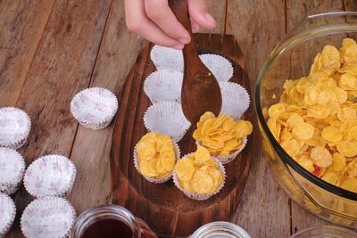 High angle view of person preparing food on table