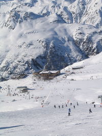 High angle view of people skiing on snowcapped mountain