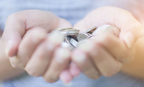 Close-up of hand holding ring