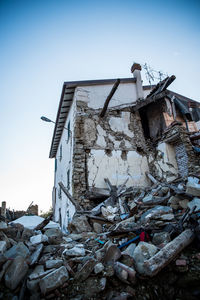 Damaged building against clear sky