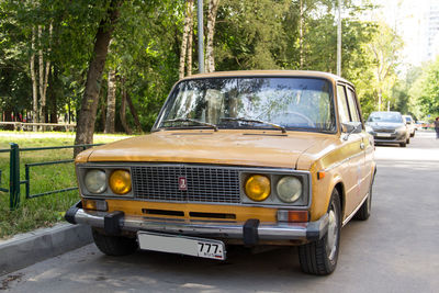 Vintage car parked on road in city