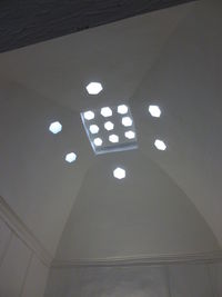 Low angle view of illuminated ceiling