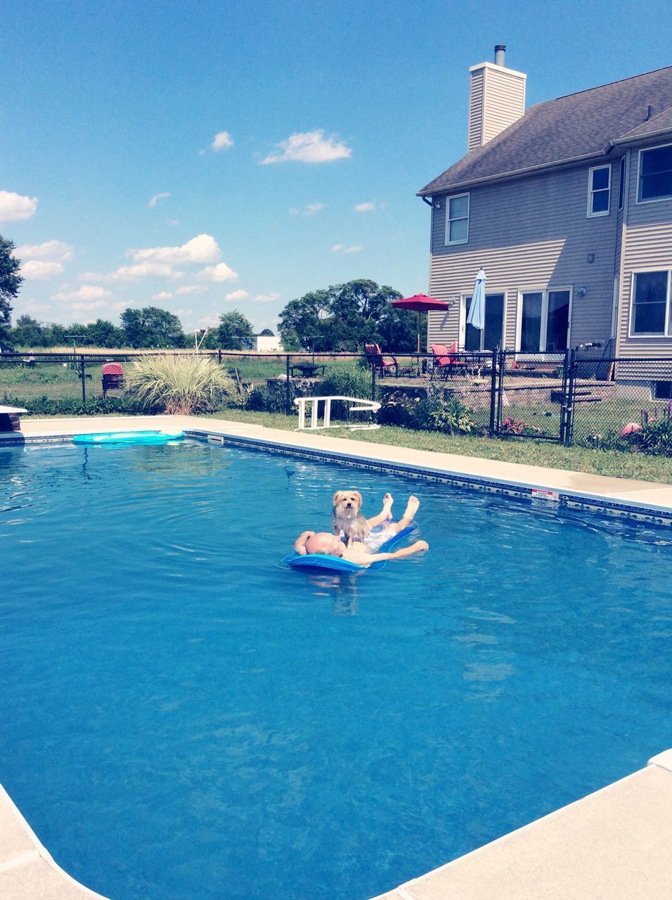 SWIMMING POOL AGAINST SKY