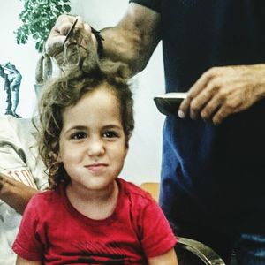 Close-up of boy sitting