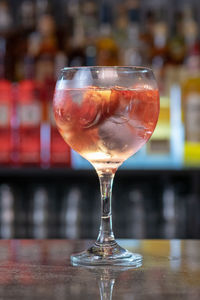 Close-up of wineglass on table