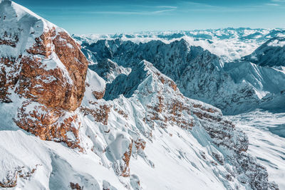 Scenic view of snowcapped mountains against sky