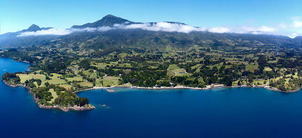 Aerial view of bay against clear blue sky