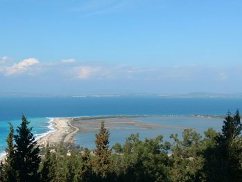 Scenic view of sea against blue sky