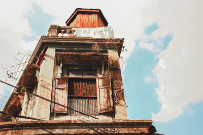 Low angle view of old building against sky