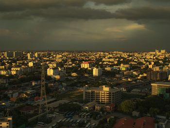 High angle view of cityscape against cloudy sky