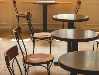 Empty chairs and table in cafe