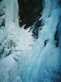 High angle view of person ice climbing