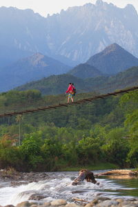 Man on mountain against sky