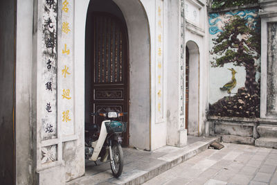 Motor scooter parked outside building