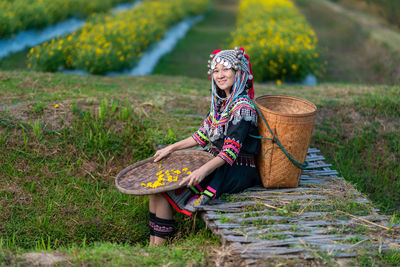 Woman sitting on field